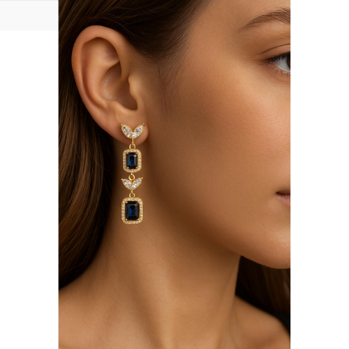 Luxury earrings with a rectangular blue stone and shiny gold trim
