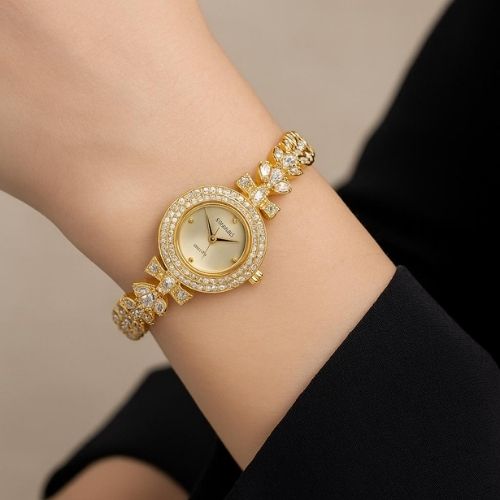 Women's luxury watch - gold design with a jeweled bezel and leaf-detail strap