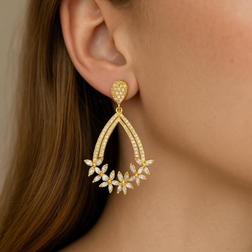 Luxury gold earrings with a floral design encrusted with zircon